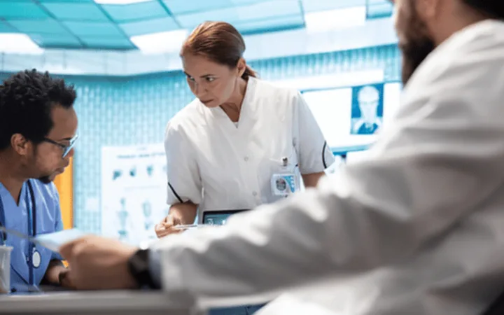 Hospital care team reviewing a patient's medical information