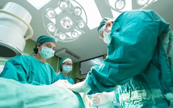 Surgical team providing care in an operating room